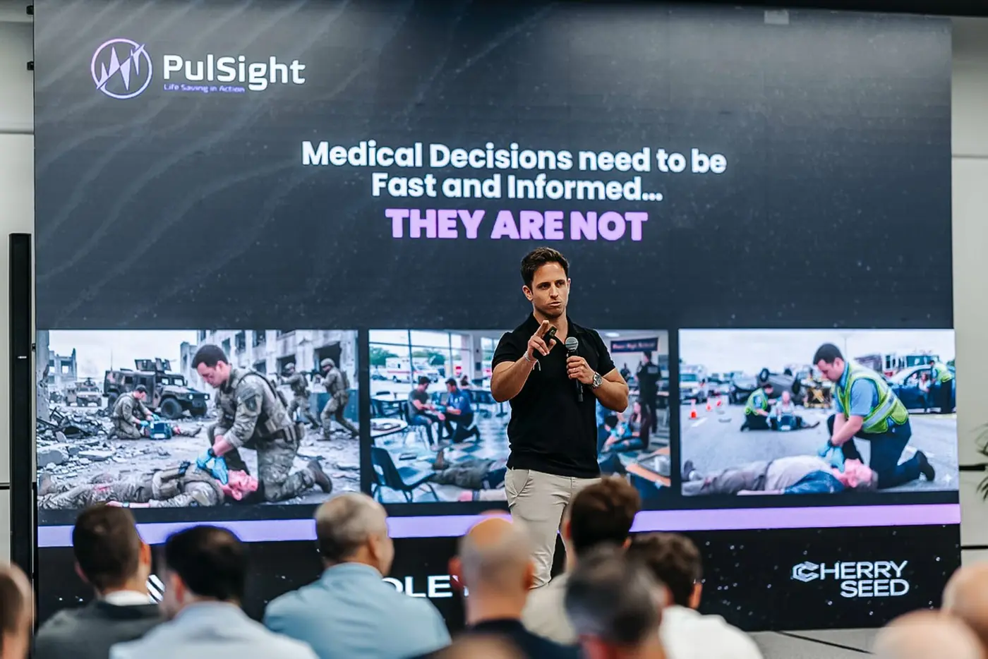 A Cherry Seed founder pitching a medical startup on stage.